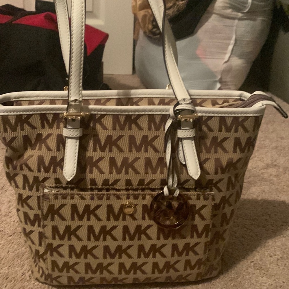 Michaels kors purse. The straps are torn a little